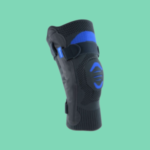 Hinged knee brace with soft fabric